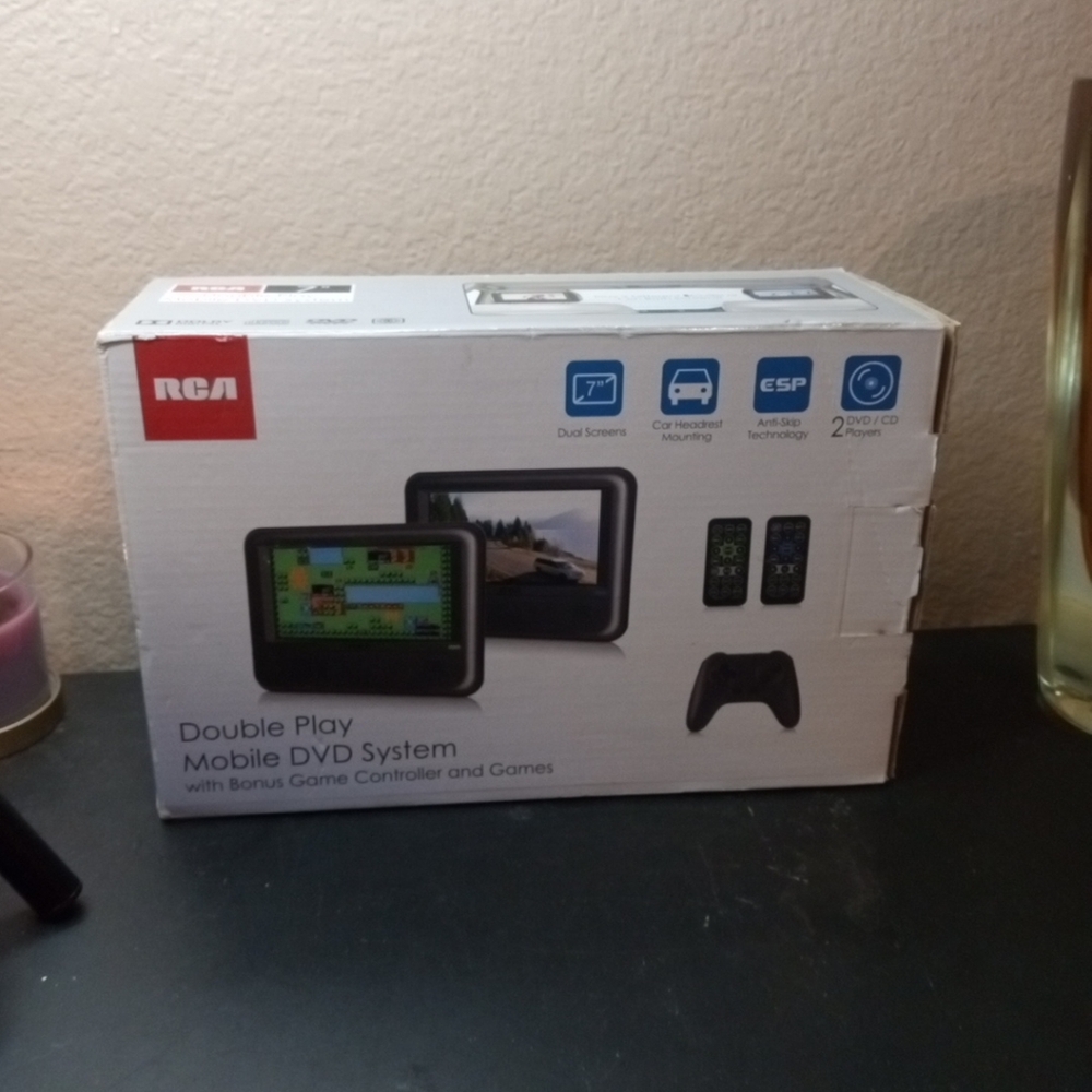 NIB RCA Dual 7" Mobile DVD System With Bonus Controller And Games.